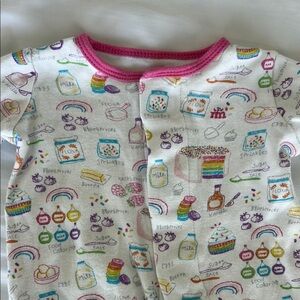 Magnetic onesie with fun cake design